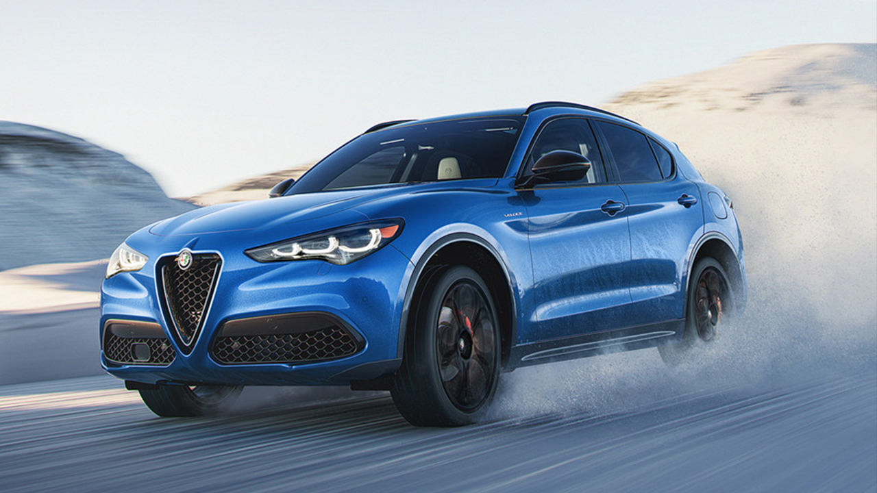 3/4 front and side view of the Alfa Romeo Stelvio 2026 on a snowy road at full power