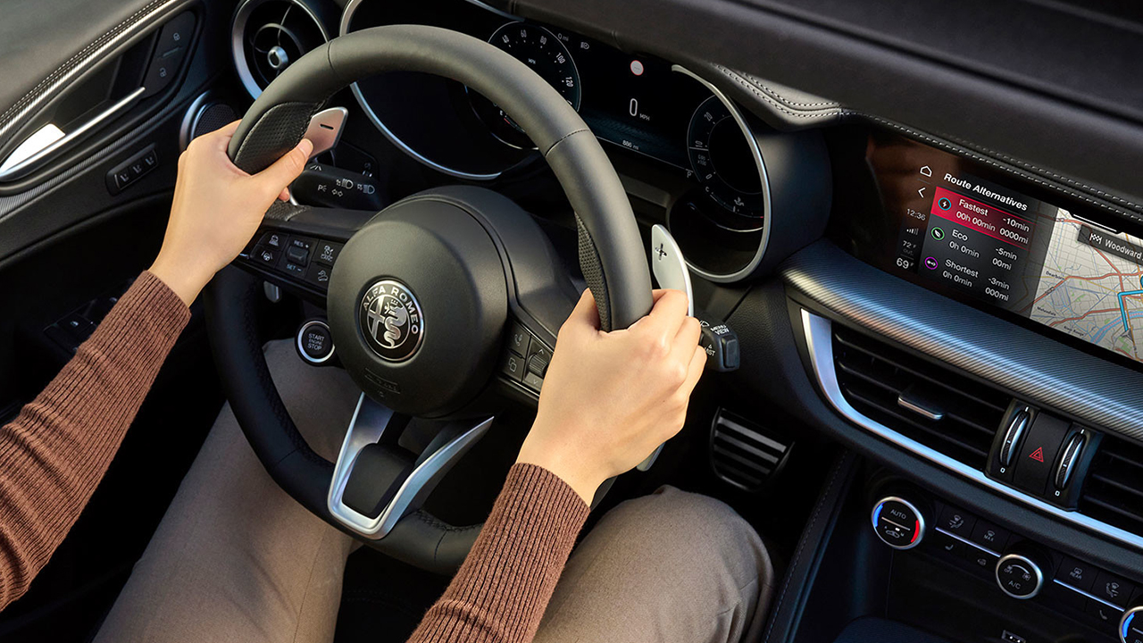 View of a female owner of a 2026 Alfa Romeo Stelvio at the wheel