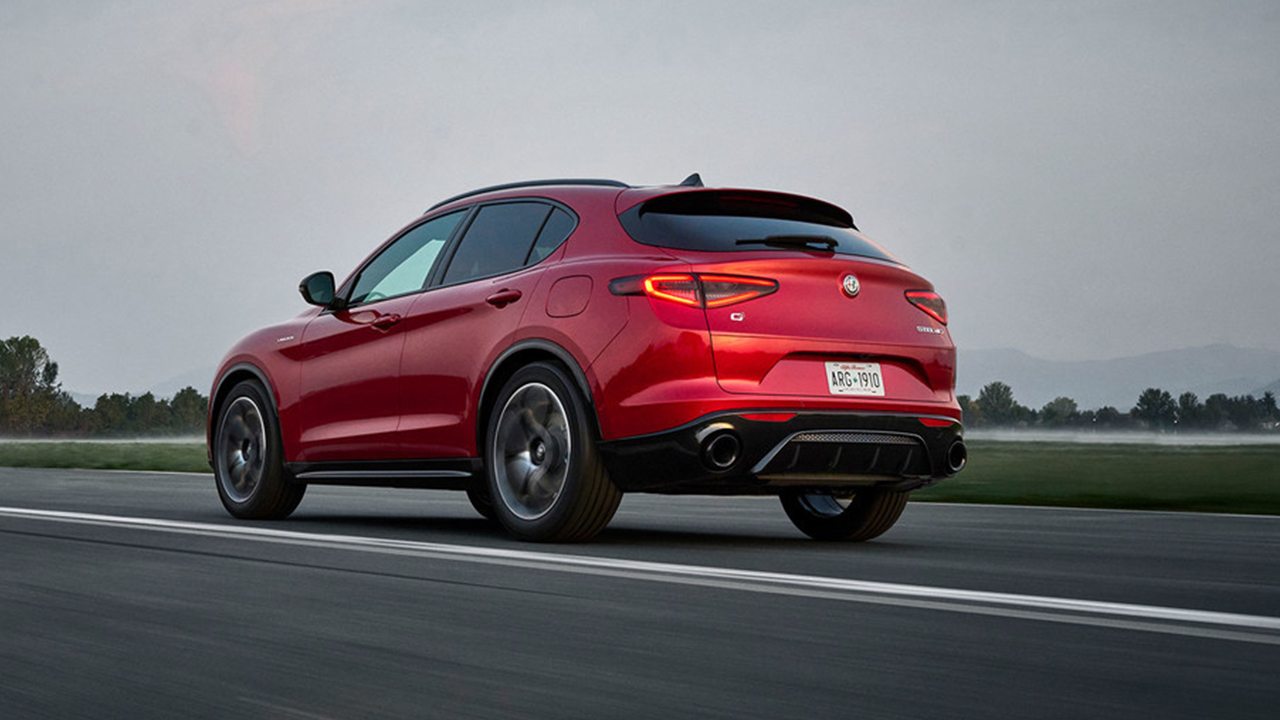 Rear view of a 2026 Alfa Romeo Stelvio on the road at full power