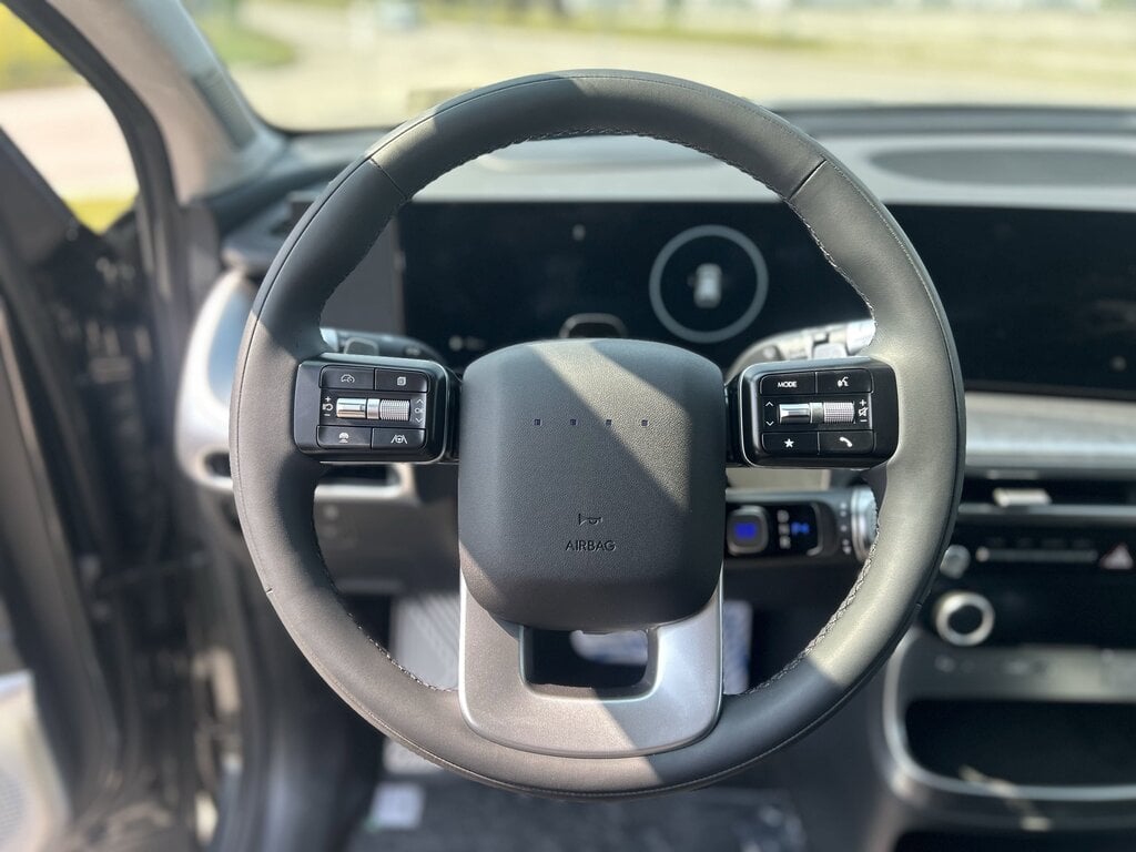 The image showcases the steering wheel of the 2026 Hyundai IONIQ 9