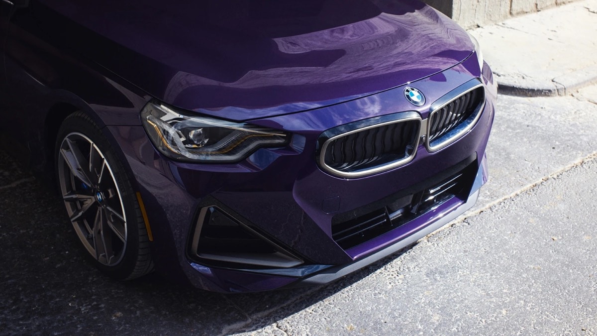 Front view of the 2022 BMW 2-Series Coupe in Techno Purple Metallic