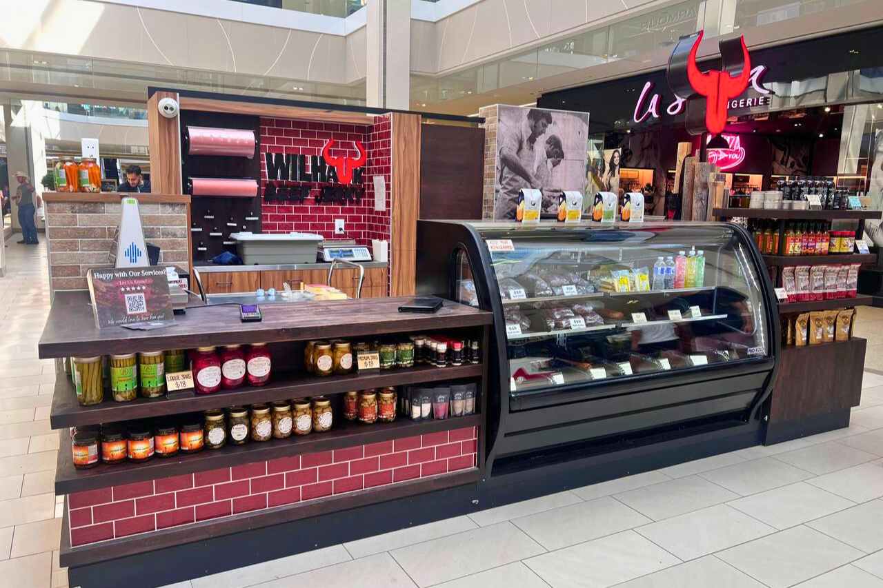 The Wilhauk Jerky stand in West Edmonton Mall, displaying a variety of food products and beef jerkey. 