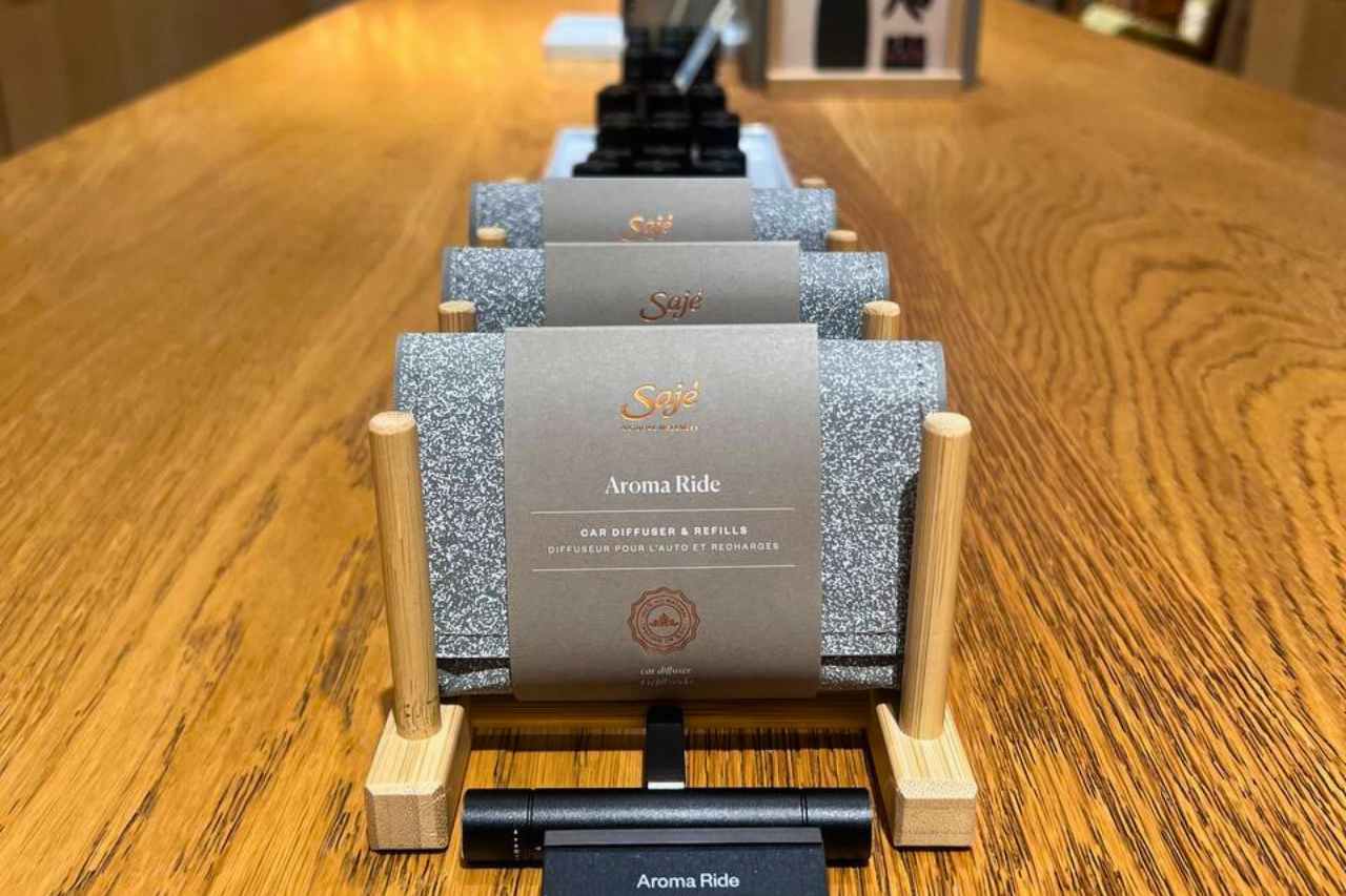 A row of Aroma Ride diffusers on display at Saje Wellness in West Edmonton Mall, perfect for a road trip.