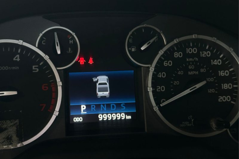 A close-up of Jason's Toyota Tundra odometer, showing 999,999km.